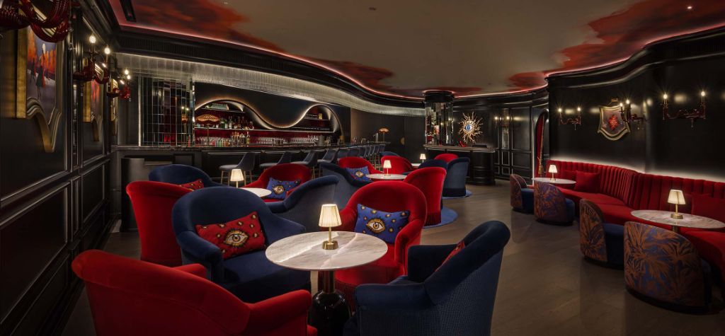 Maison Dali Interior - Bar Dali with surrealist red and navy velvet seating